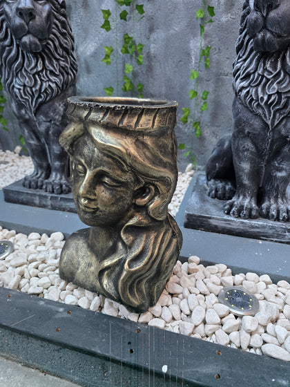 Athena goddess planter with antique gold finish

Decorative female face planter for flowers and succulents

Antique gold garden planter inspired by Greek sculpture

Luxury decorative planter for indoor and outdoor use