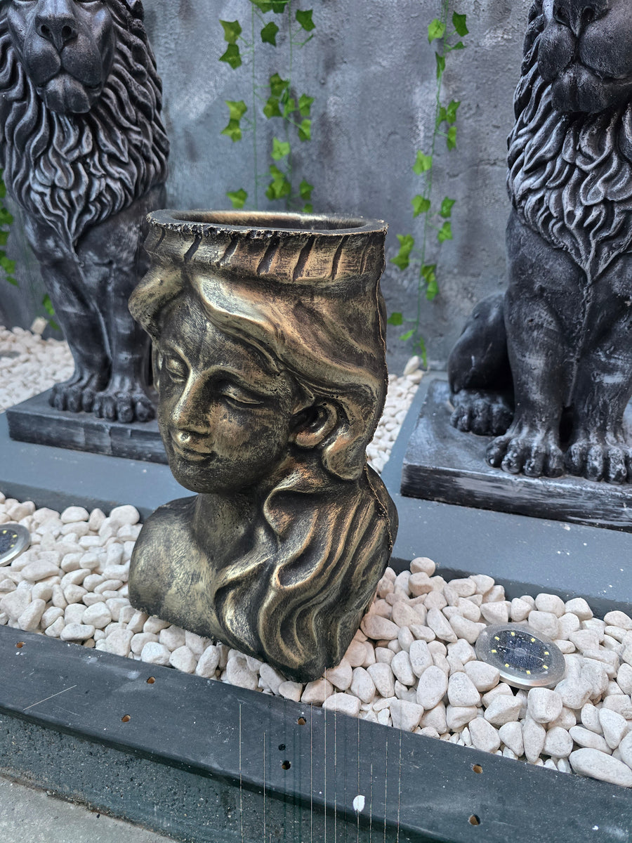Athena goddess planter with antique gold finish

Decorative female face planter for flowers and succulents

Antique gold garden planter inspired by Greek sculpture

Luxury decorative planter for indoor and outdoor use
