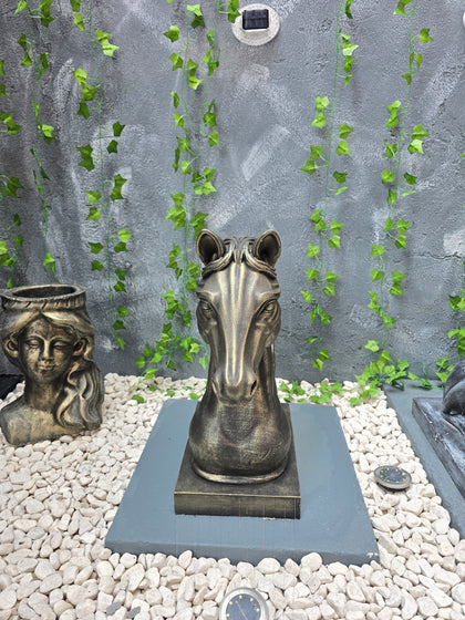 Front view of handcrafted concrete horse bust garden ornament